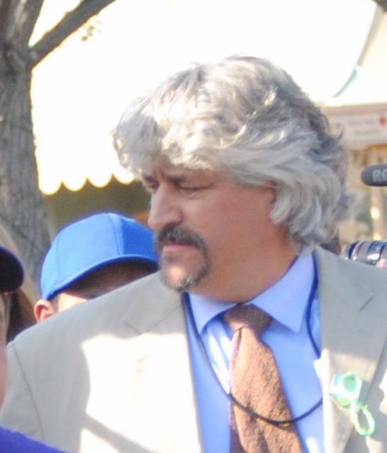 Hall of Fame trainer Steve Asmussen gets 11,000th win at Remington Park with son Erik in the saddle.