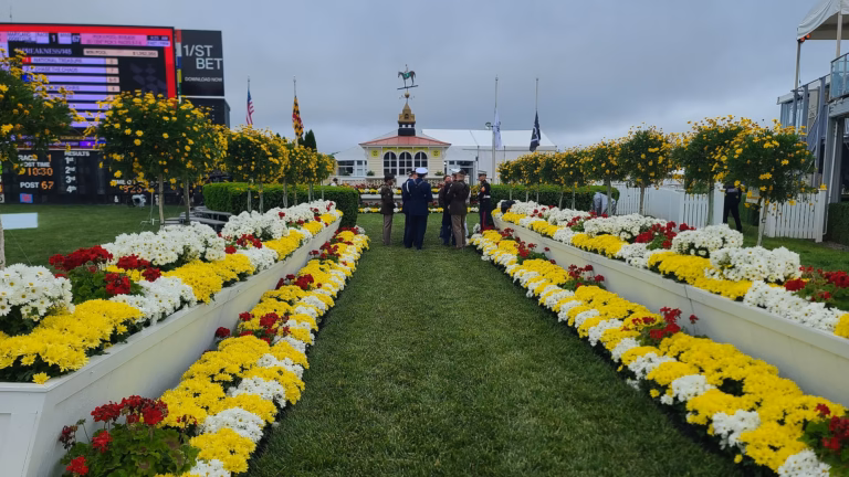 The Winner's Circle and Old Clubhouse lined with Black-Eyed Susans on Preakness Day, May 20, 2023.