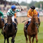 Two jockeys fighting each other with their whips.